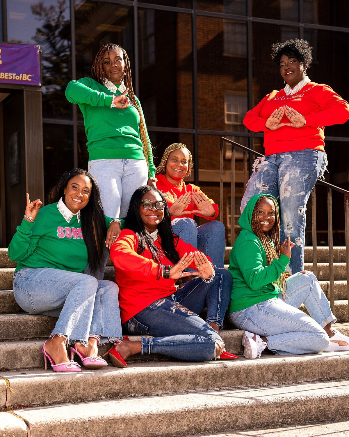 Red and Green Soror crewneck – six women on campus steps – COSIGN1975